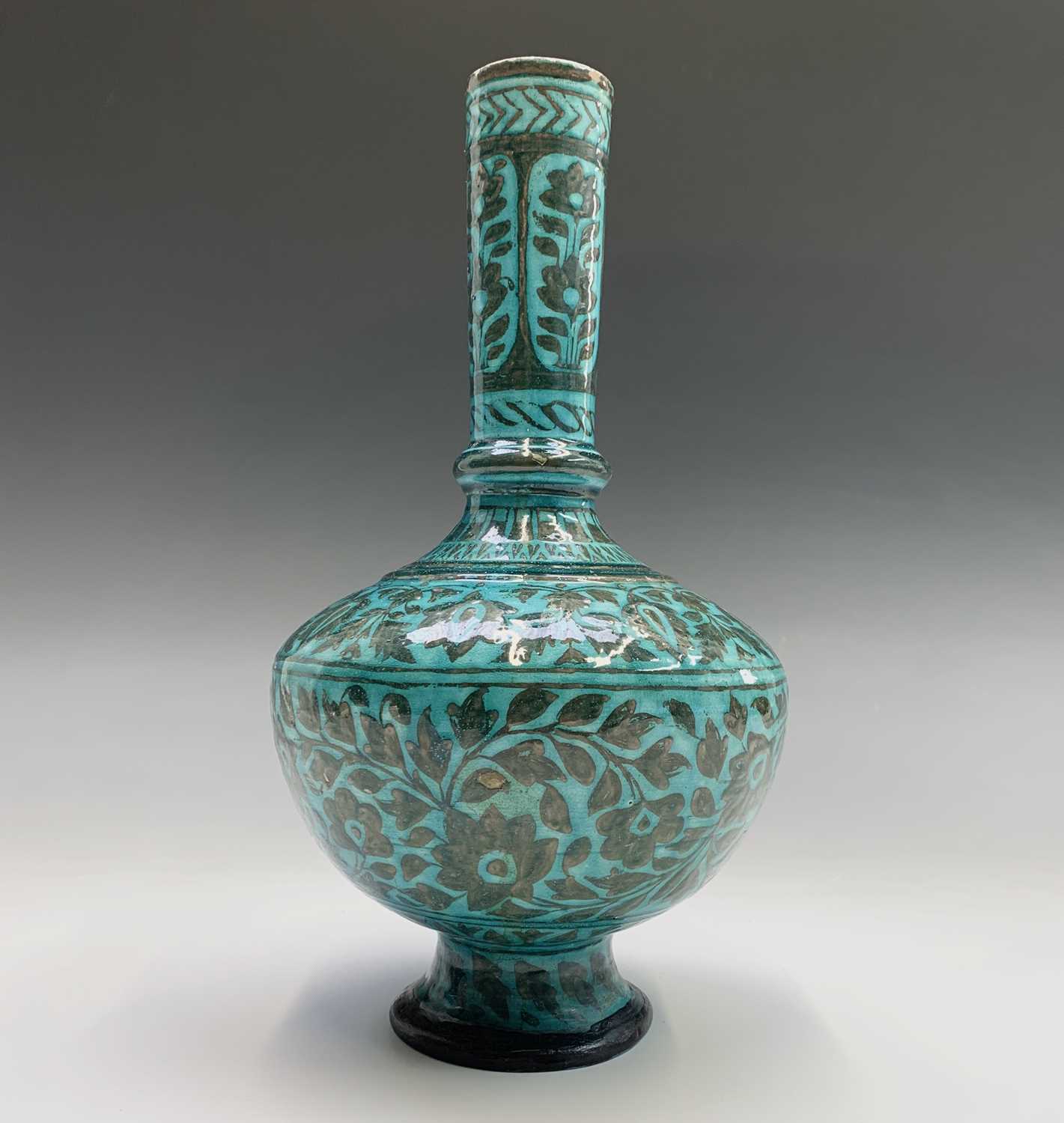 A Persian pottery bottle vase, the turquoise ground with scrolling leafy vines and flowerheads, - Image 2 of 4