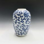 A Chinese blue and white jar, circa 1900, in Ming style, with flowerheads blossoming amongst