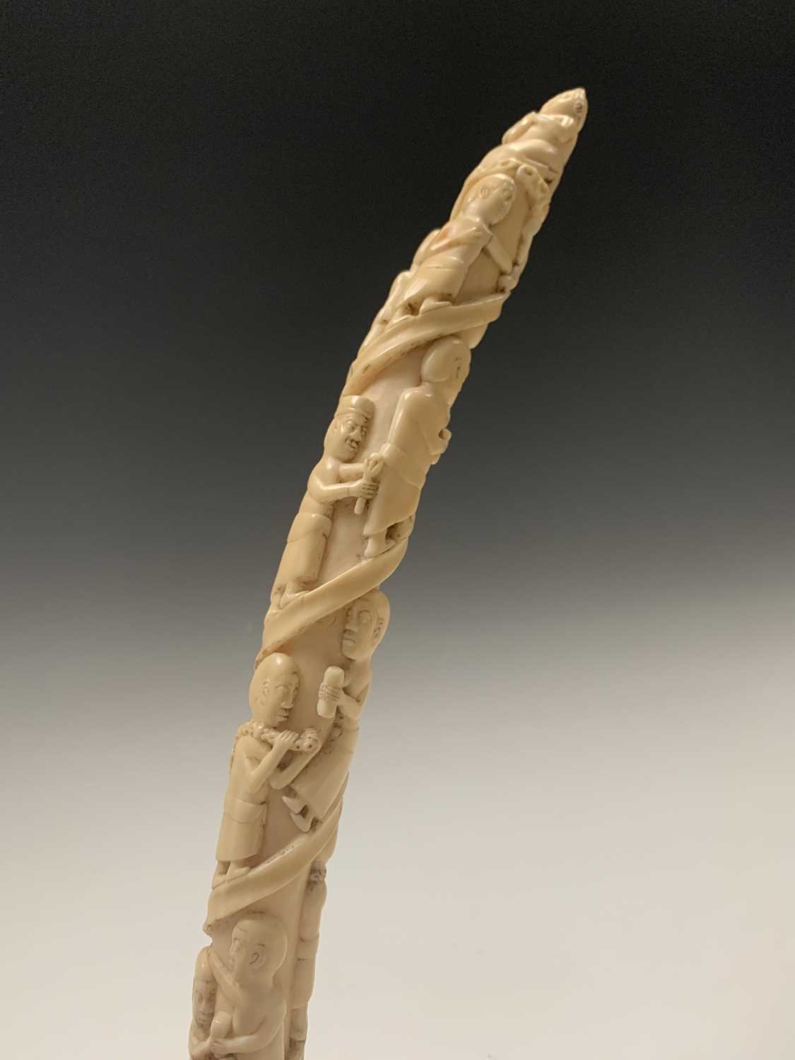 An African Loango ivory tusk, late 19th century, carved with porters some of which are carrying - Image 9 of 10