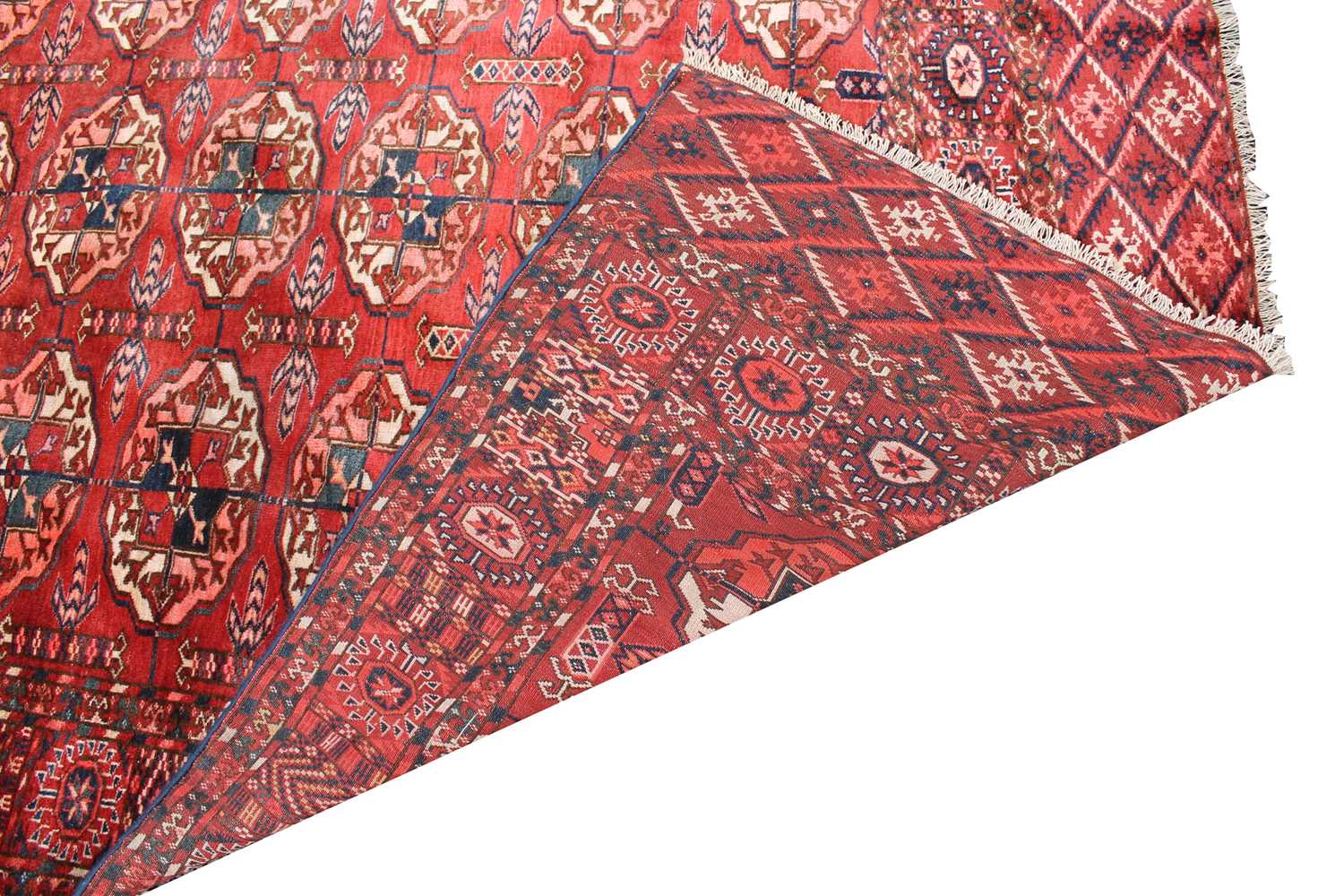 A Tekke carpet, Turkmenistan, circa 1890, the madder field with ten rows of five medallions, - Image 3 of 13