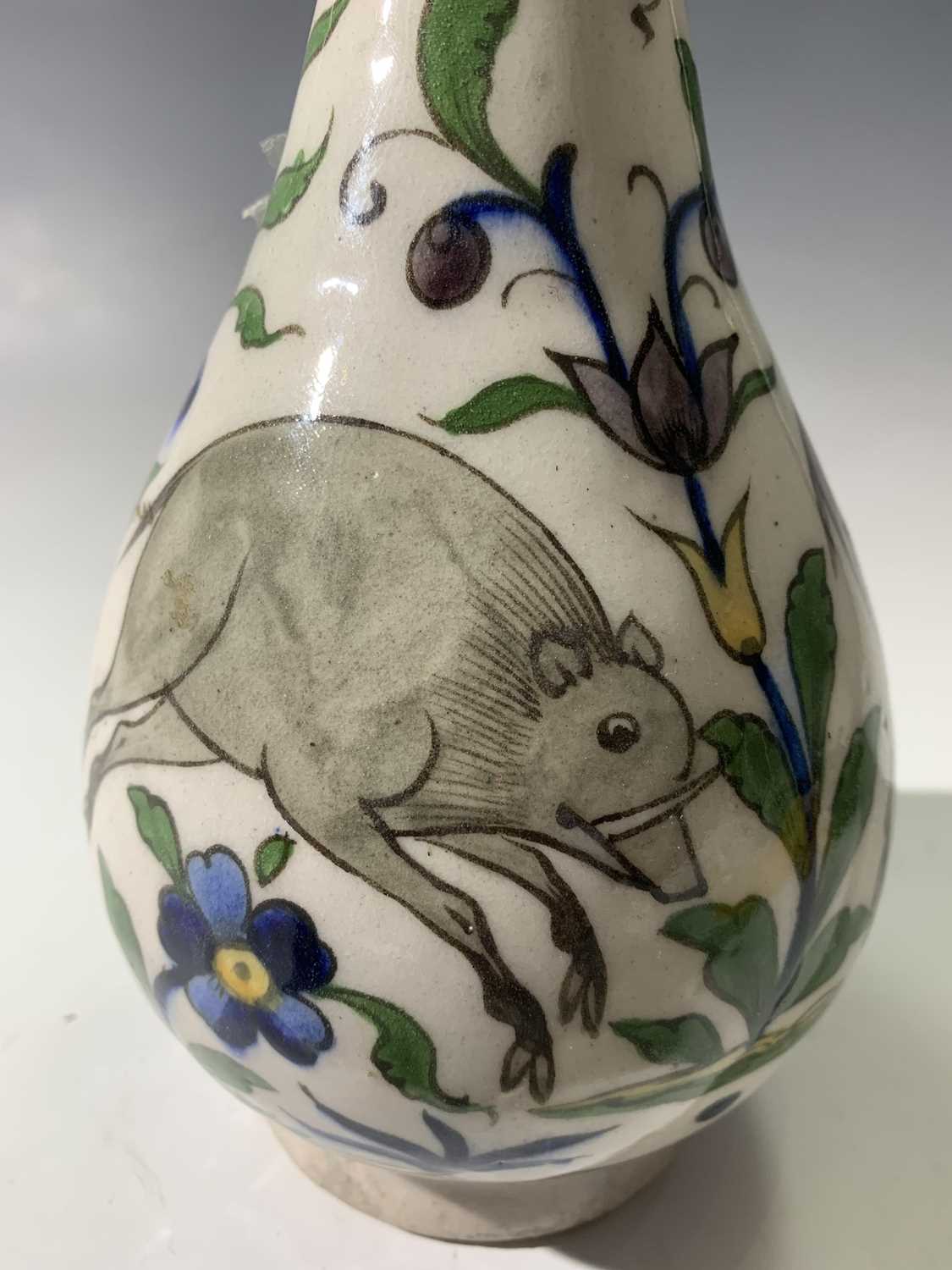 A Persian pottery bottle vase, circa 1900, the white ground with wild boar amongst stylised - Image 7 of 13