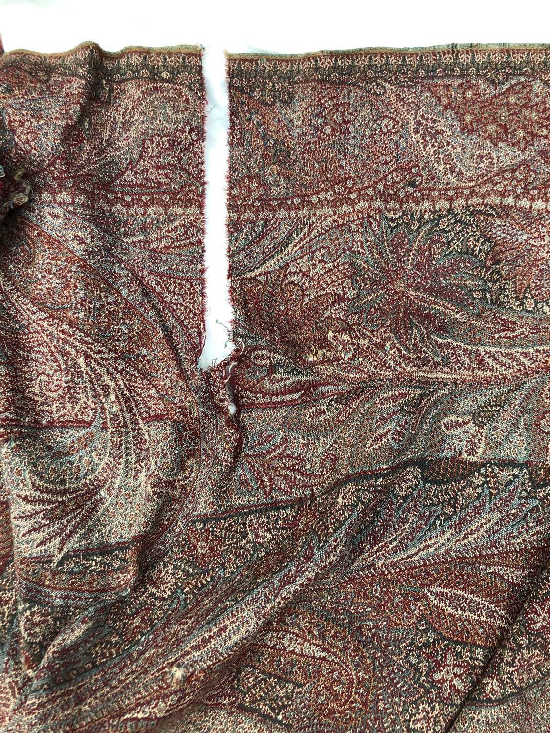 A large woven paisley shawl, 255 x 164cm.Condition report: Tears and holes of various sizes - Image 3 of 7