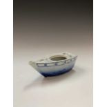 A Japanese porcelain teapot in the form of a boat, late 19th century, with character marks,