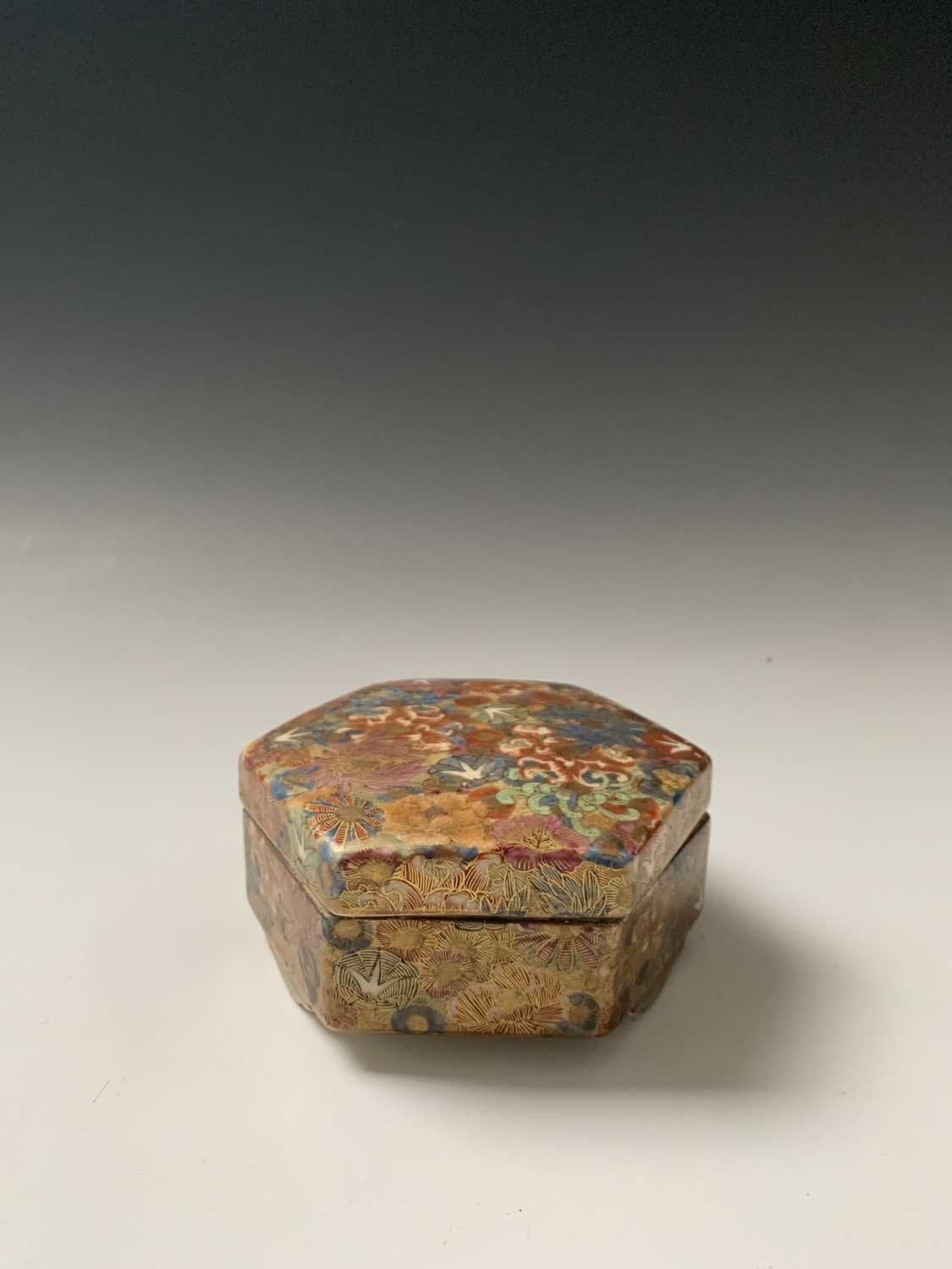 A Japanese satsuma millefleur hexagonal box and cover, Meiji Period, signed, height 5.5cm, width
