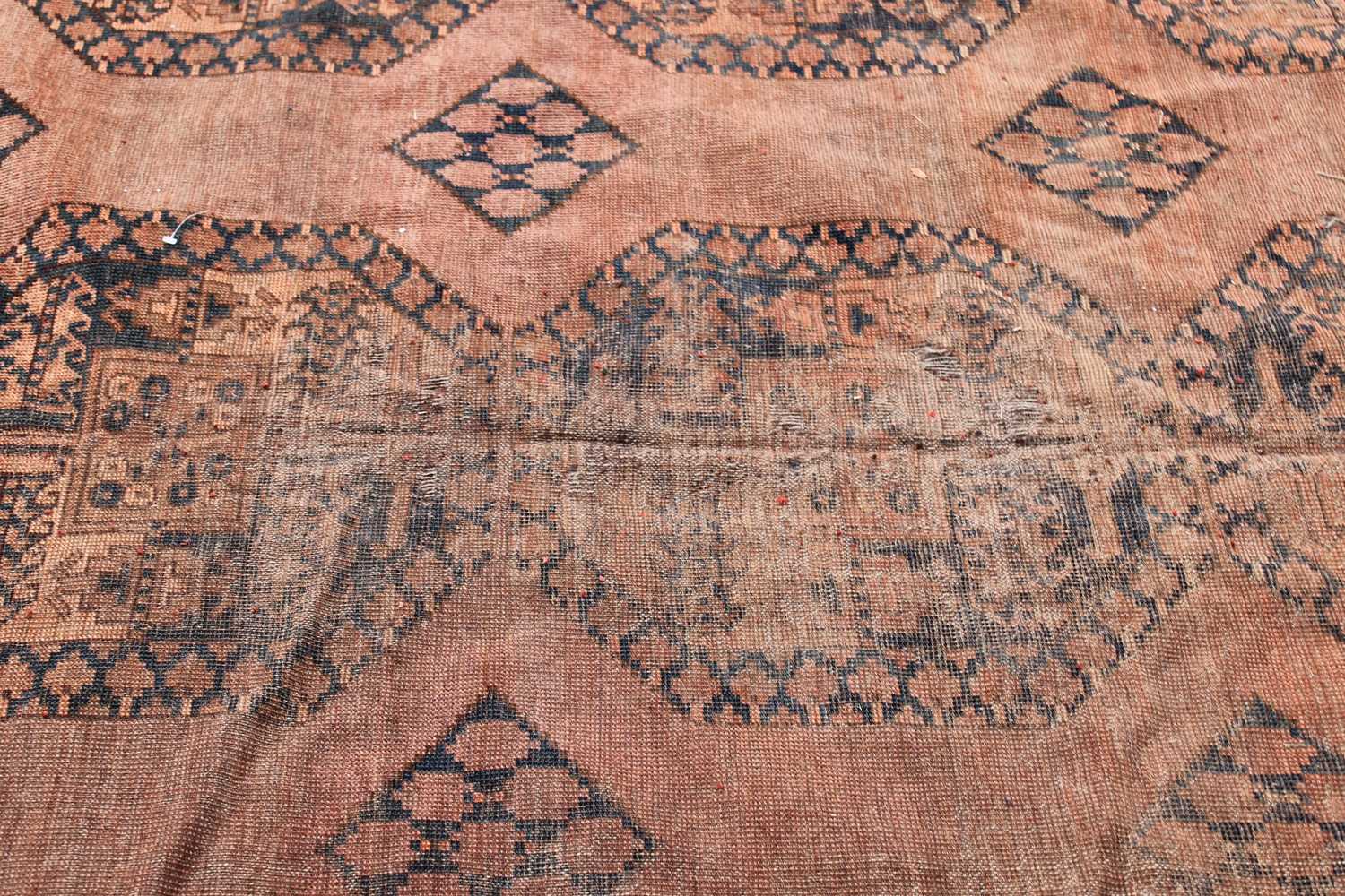 An Afghan Ersari carpet, the camel field with six rows of three octagonal medallions, within a - Image 3 of 4