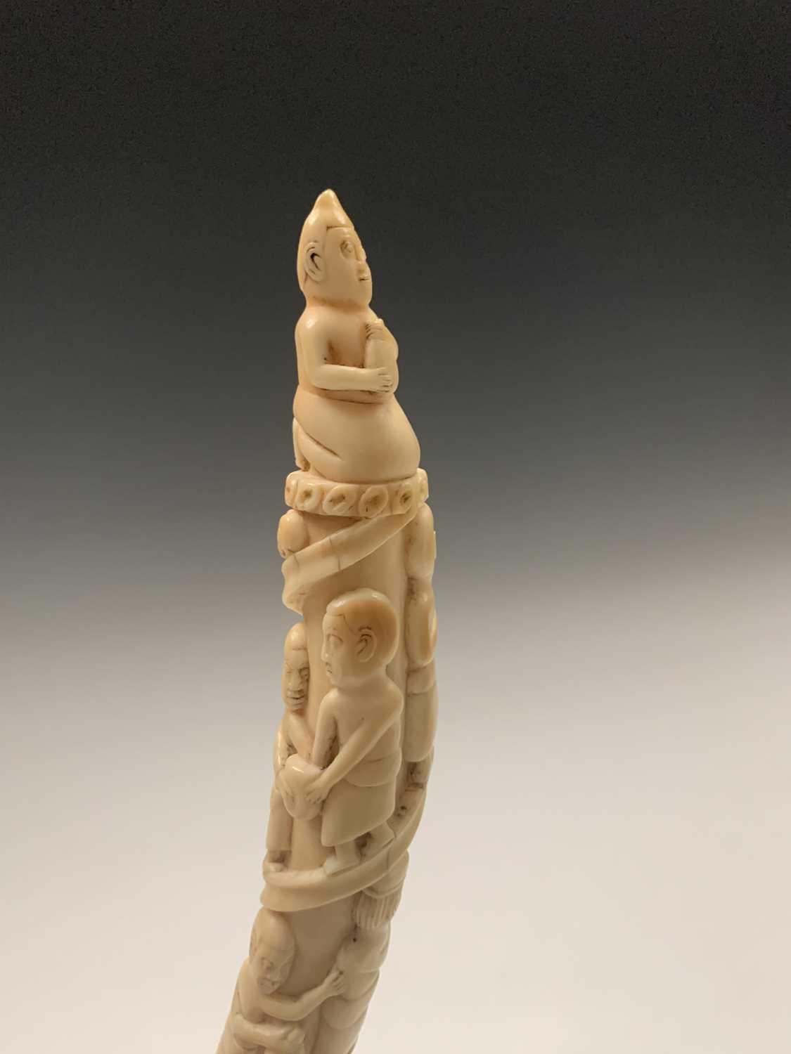 An African Loango ivory tusk, late 19th century, carved with porters some of which are carrying - Image 4 of 10
