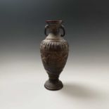 A Japanese bronze twin-handled vase, Meiji Period, the trellis design ground with birds and a