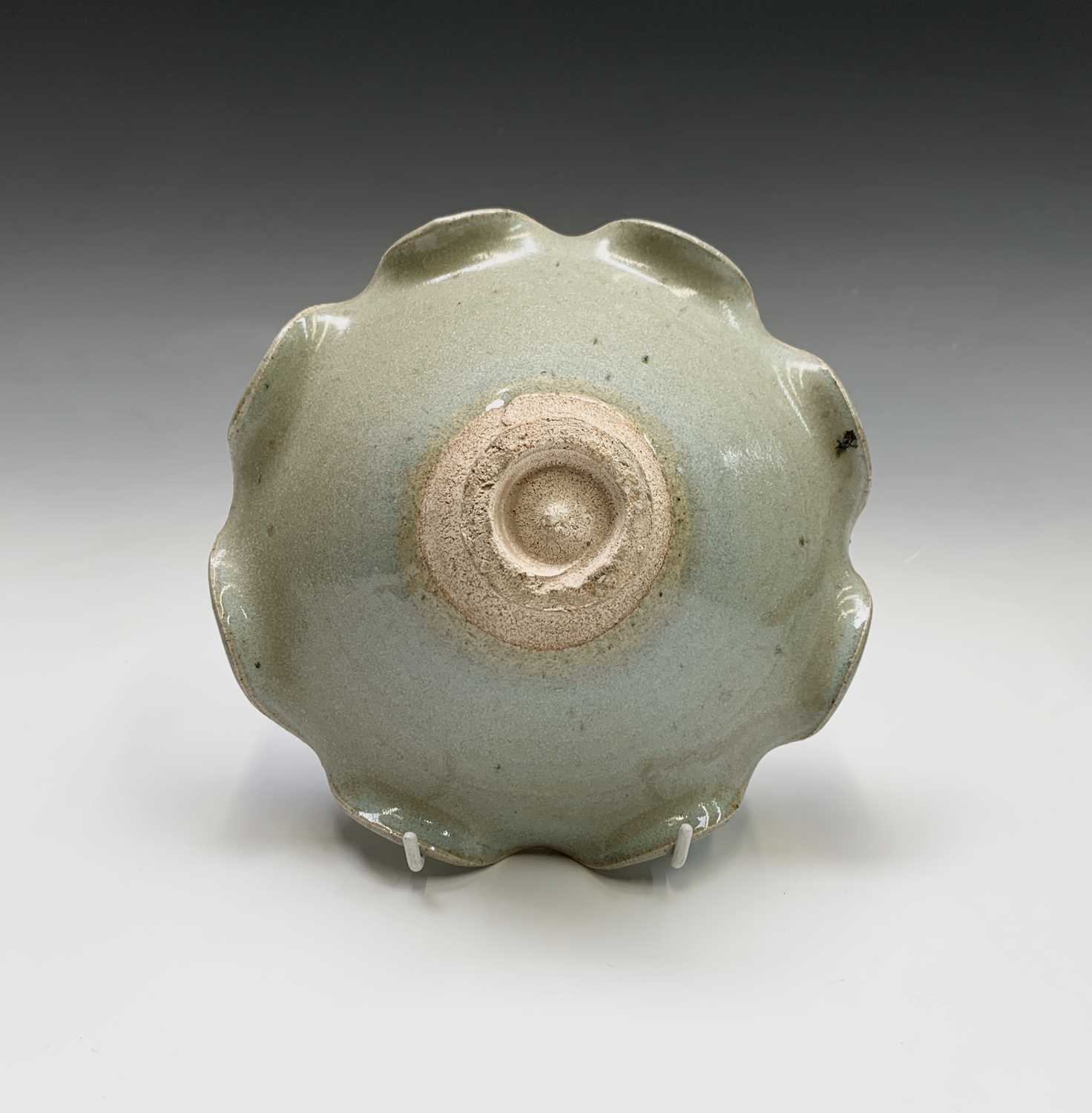 A footed pottery celadon glazed bowl, with scalloped rim, height 8.5cm, diameter 20cm.Condition - Image 2 of 7