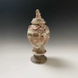 A Japanese Satsuma vase and cover, late 19th century, signed, the cover surmounted with a dog of