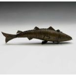 A Chinese brass articulated fish, circa 1900, the hinged head opening to reveal a section possibly