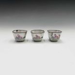 A set of three Chinese enamel famille rose wine cups, 18th century, each decorated with three