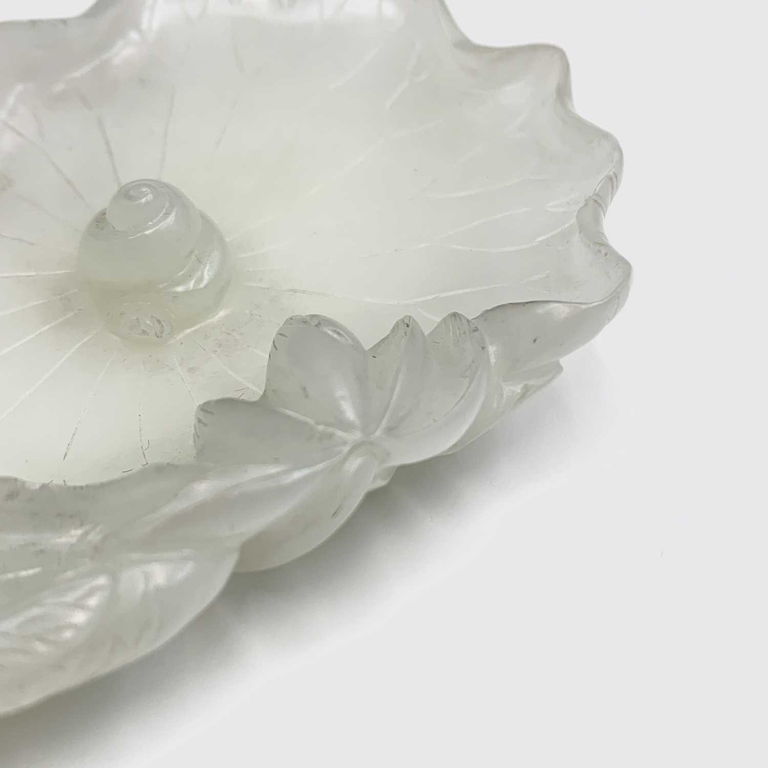 A Chinese white jade 'lotus leaf' brushwasher, 19th Century, height 2.5cm, width 13cm, depth 8.5cm. - Image 10 of 20