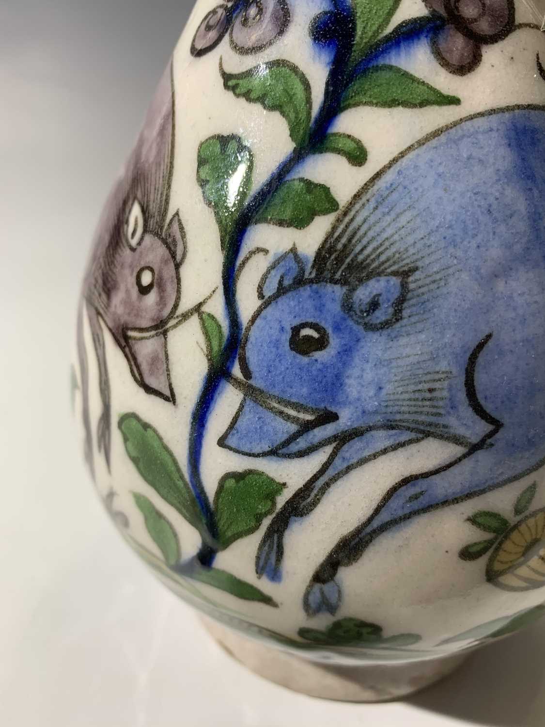 A Persian pottery bottle vase, circa 1900, the white ground with wild boar amongst stylised - Image 11 of 13