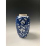 A Chinese blue and white prunus pattern jar, 19th century, height 23.5cm, width 14cm.Condition