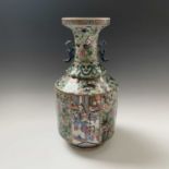 A Chinese Canton twin-handled celadon vase, 19th century, with butterflies amongst foliage above
