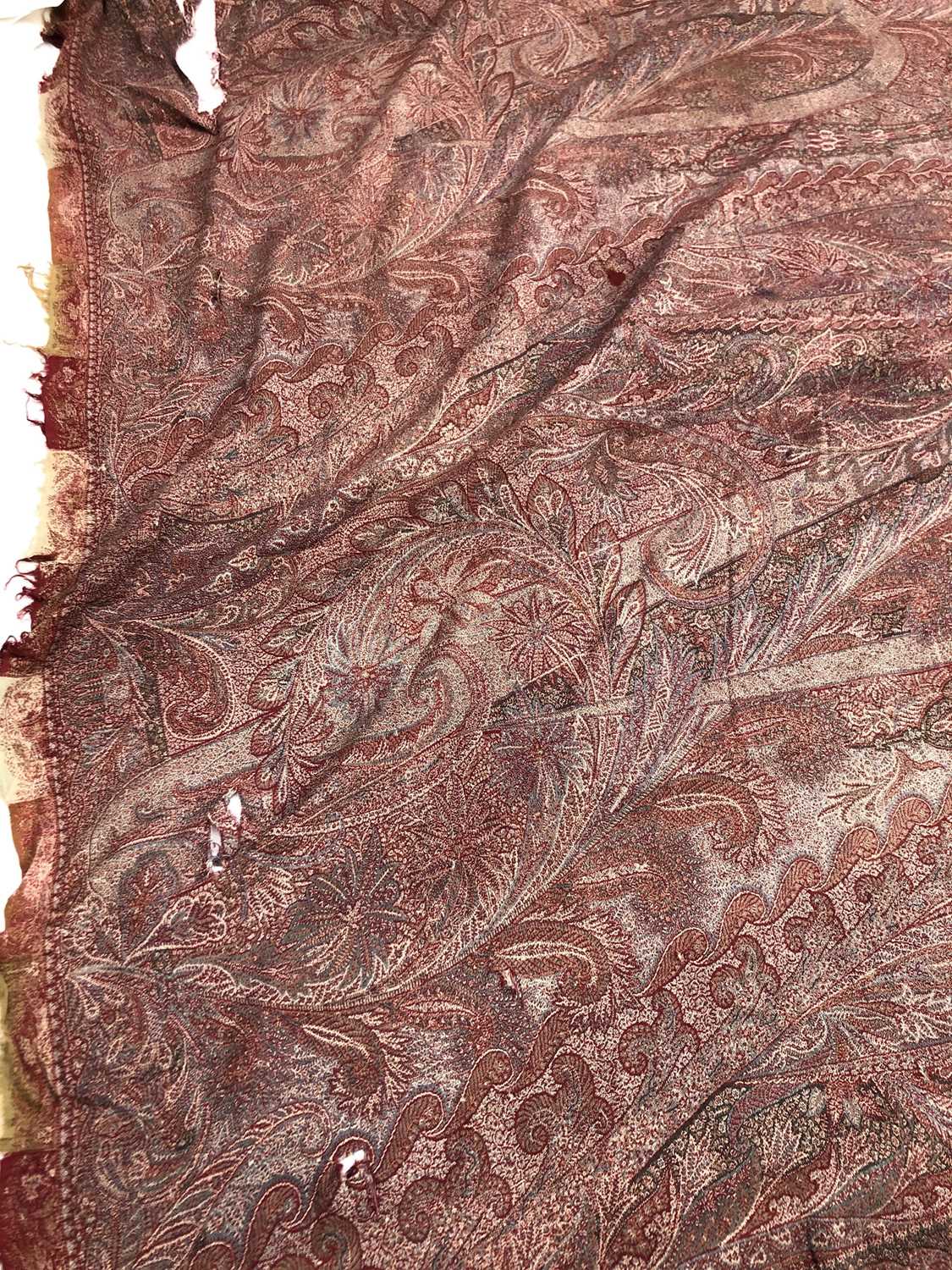 A large woven paisley shawl, 255 x 164cm.Condition report: Tears and holes of various sizes - Image 7 of 7