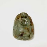 A large Chinese carved & reticulated celadon jade ornament, depicting a bird & lingzhi, with