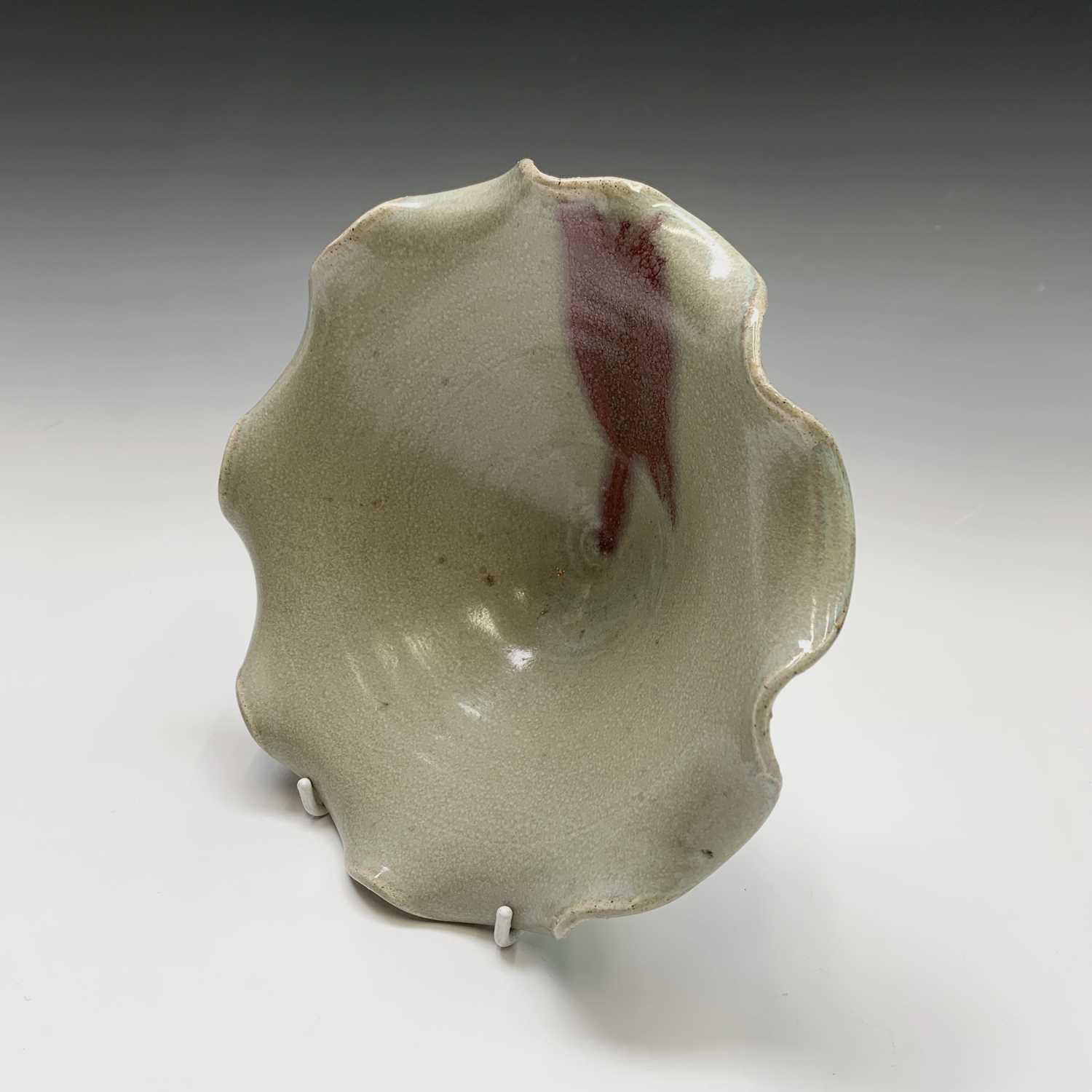 A footed pottery celadon glazed bowl, with scalloped rim, height 8.5cm, diameter 20cm.Condition - Image 3 of 7