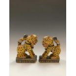 A pair of Indian carved wood figures of stylised cats, 20th century, height 16.5cm, width 6cm, depth