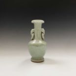 A Chinese celadon crackle-glazed vase, early 20th century, with elephnat mask handles, height 23.