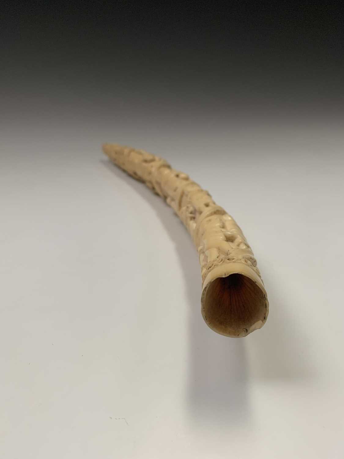 An African Loango ivory tusk, late 19th century, carved with porters some of which are carrying - Image 7 of 10