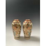 A pair of Japanese satsuma vases, Meiji Period, signed, each decorated with a river scene with