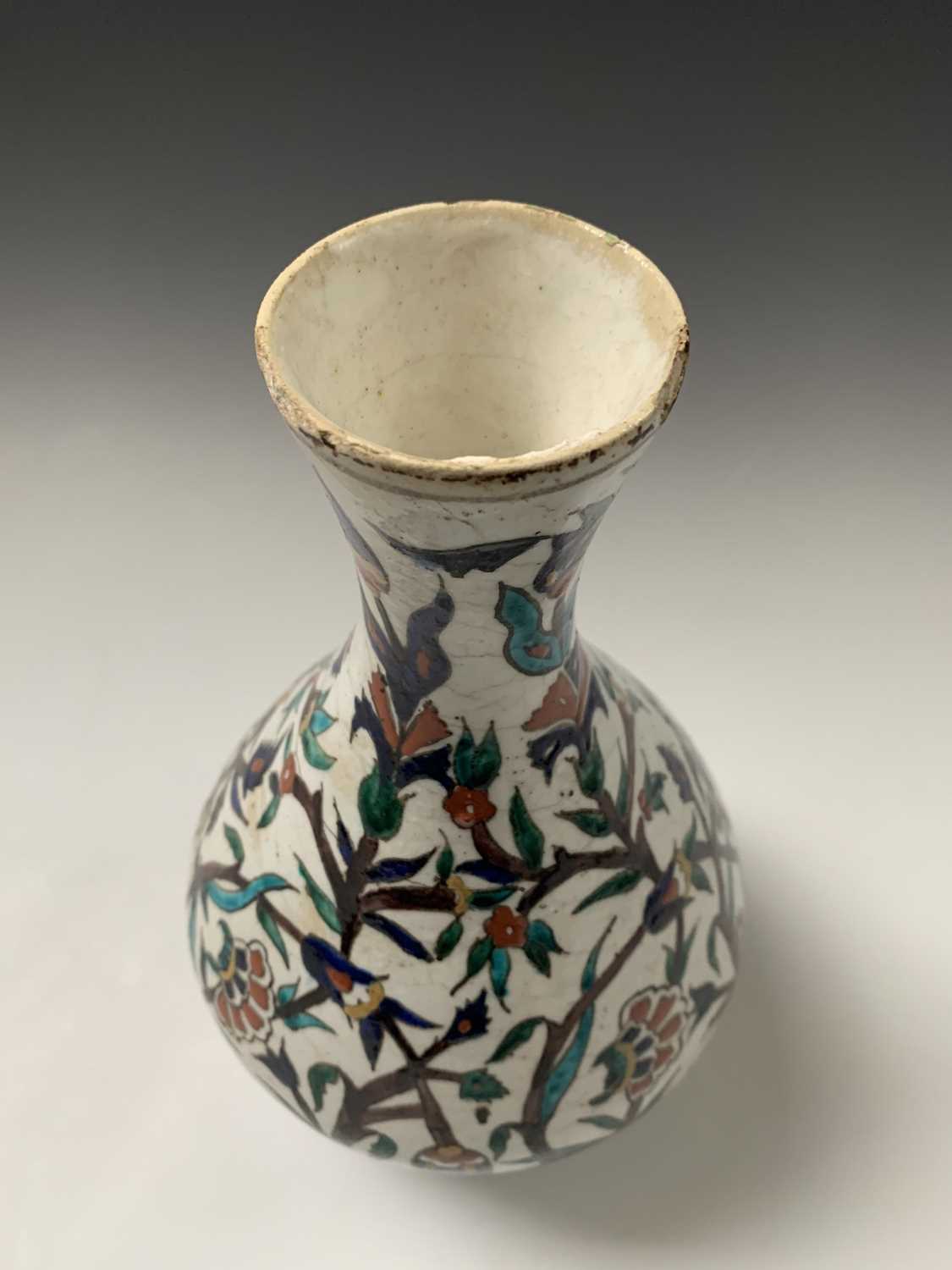 An Iznik pottery vase, 19th century, the bulbous body with a white ground and decorated with - Image 5 of 14