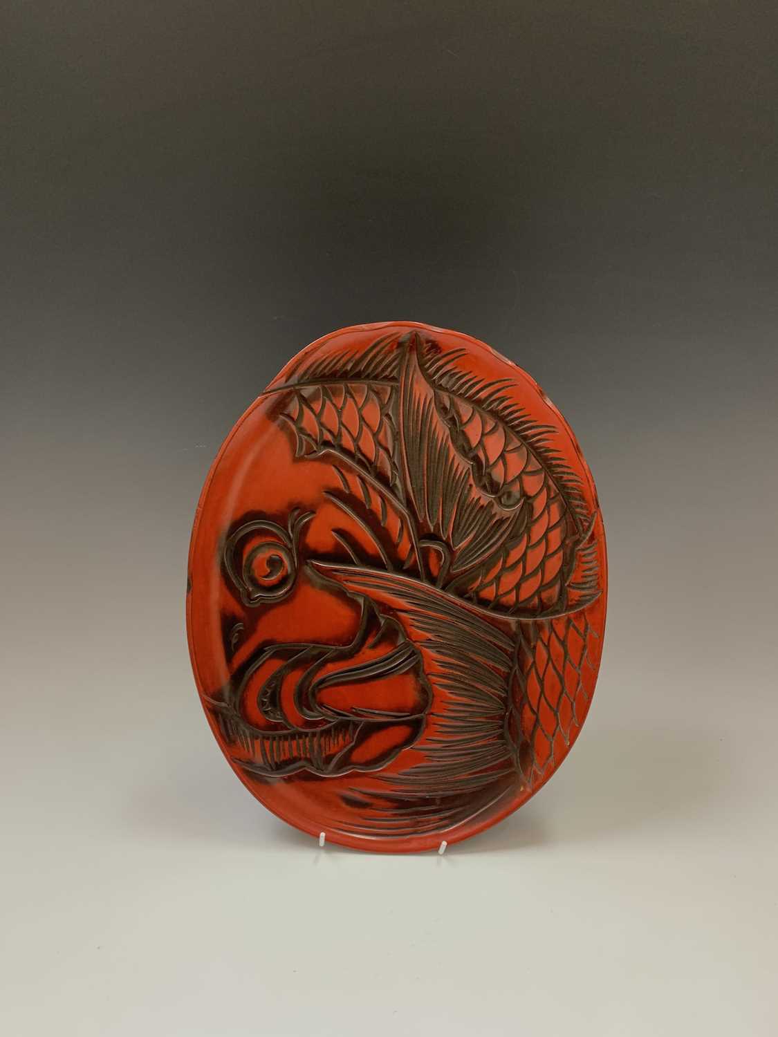 A Japanese red lacquer tray, early 20th century, depicting a koi carp, paper label to verso, 28 x - Image 2 of 3