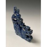 A Chinese lapis lazuli carving of a boy on a sea serpent, height 11cm, width 10cm.Condition