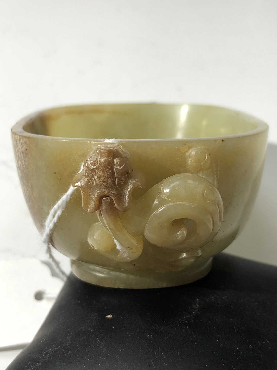 A Chinese jade water pot, 18th century, with twin horned beast handles, the front and rear with - Image 10 of 14