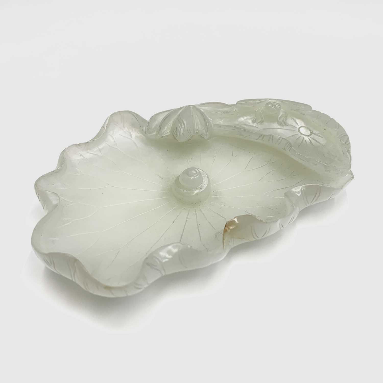 A Chinese white jade 'lotus leaf' brushwasher, 19th Century, height 2.5cm, width 13cm, depth 8.5cm. - Image 8 of 20