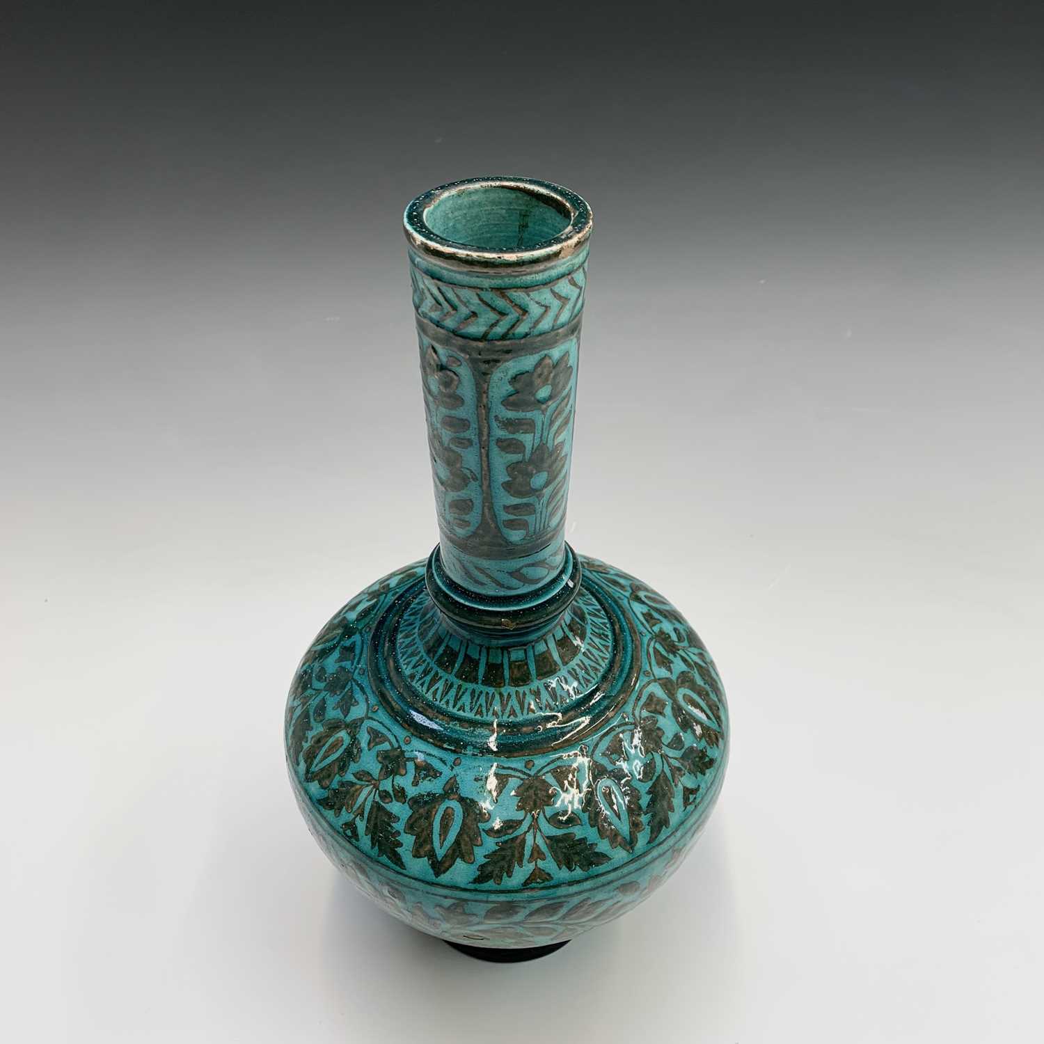 A Persian pottery bottle vase, the turquoise ground with scrolling leafy vines and flowerheads, - Image 4 of 4