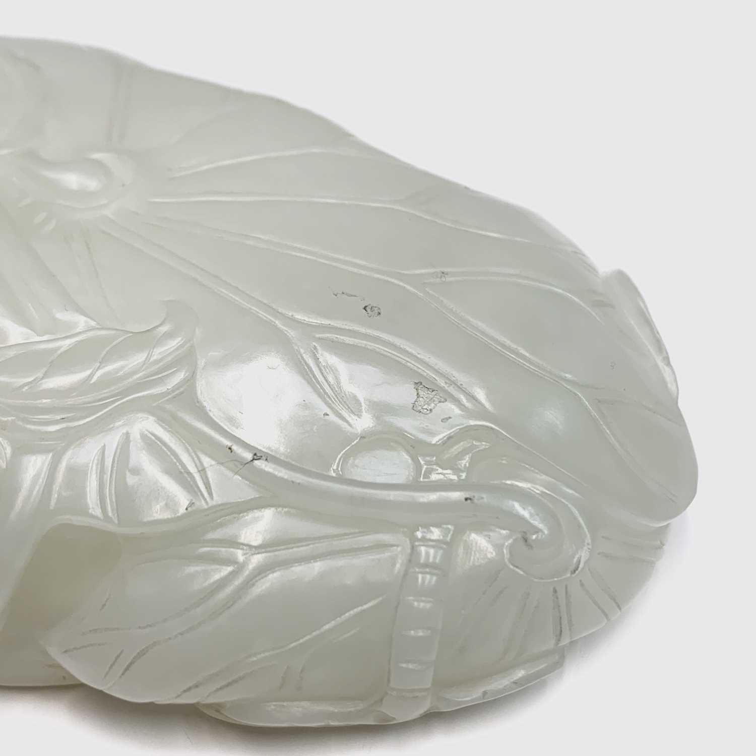 A Chinese white jade 'lotus leaf' brushwasher, 19th Century, height 2.5cm, width 13cm, depth 8.5cm. - Image 16 of 20