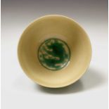 A Chinese yellow and green-glazed porcelain bowl, Kangxi Period, the body decorated with stylised