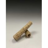 A Chinese carved ivory part opium pipe, 19th century, length 14cm.