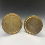 Two Cairoware brass plates, 20th century, each with silver and copper inlay, the largest with