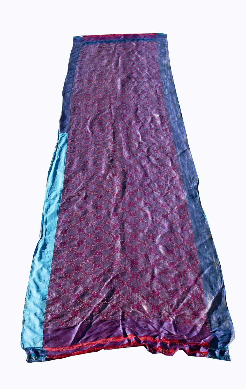 A North Indian sari, the red ground with rows of gold metal thread medallions, 488 x 109cm.Condition