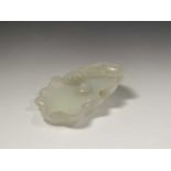 A Chinese white jade 'lotus leaf' brushwasher, 19th Century, height 2.5cm, width 13cm, depth 8.5cm.