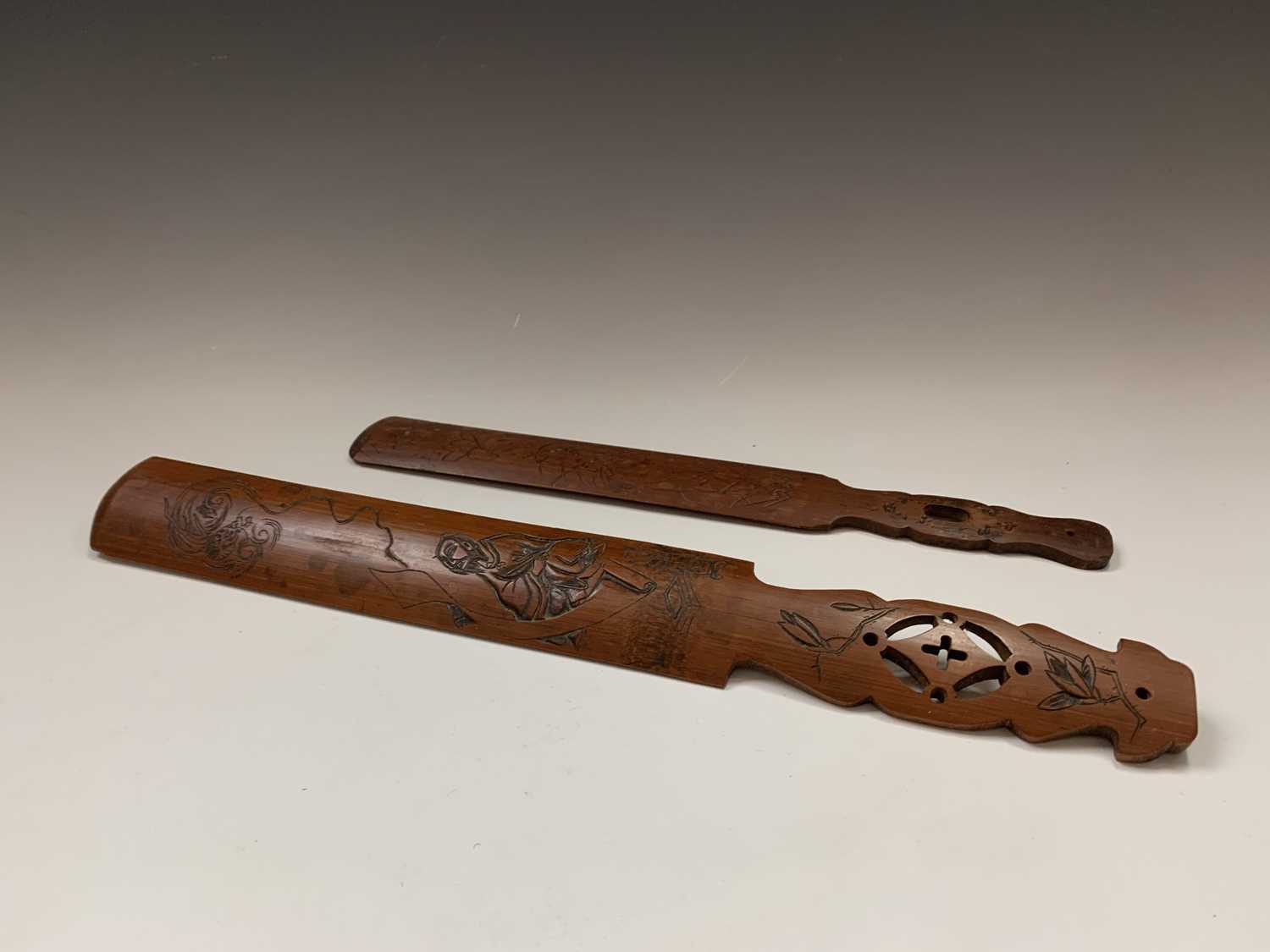 Two Japanese carved bamboo paper knives, Meiji Period, lengths 45cm and 36.5cmCondition report: UK