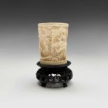 A Chinese Canton ivory carved tusk vase, late 19th century, on a wood stand, total height 10.8cm.