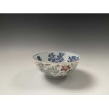 A Chinese porcelain bowl, Daoguang mark and period, 1821-1850, the ivory exterior with enamel