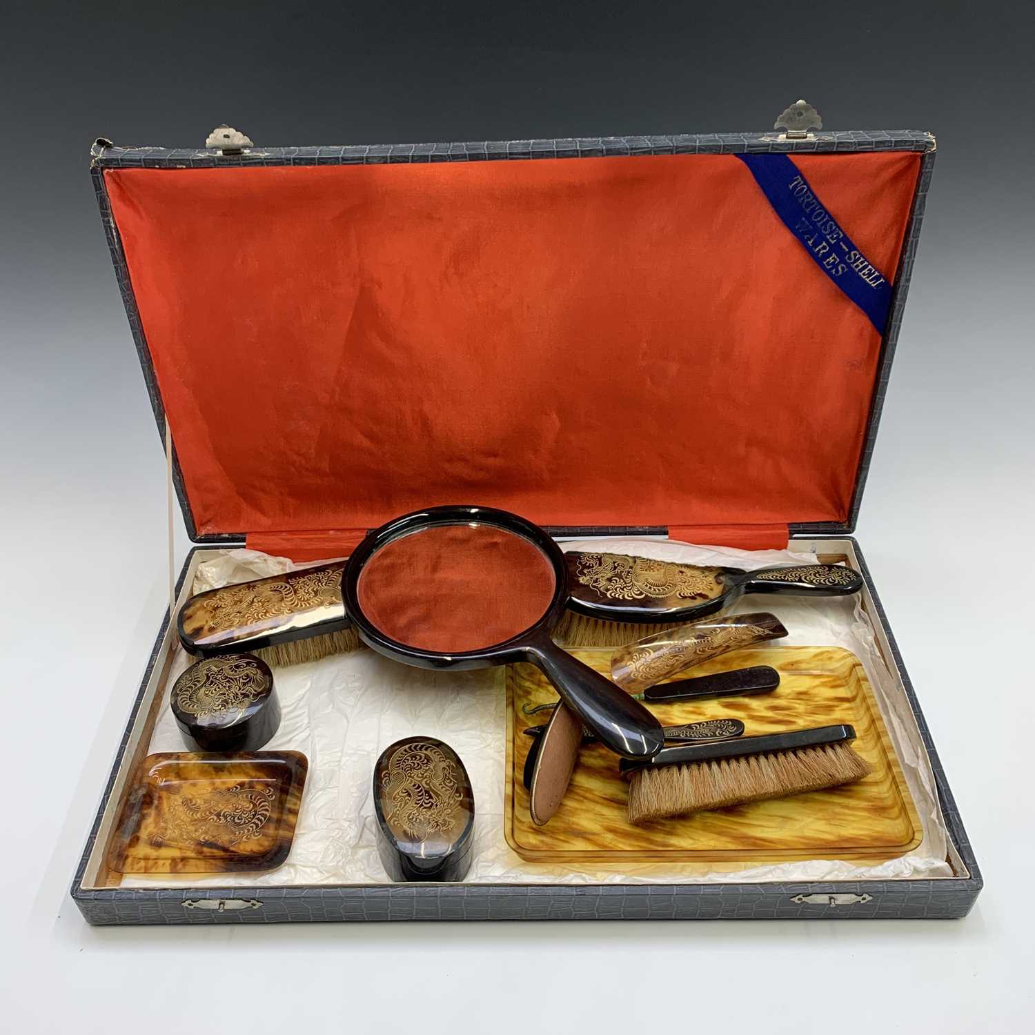 A Chinese faux tortoiseshell dressing table set, early 20th century, gilt decorated with stylised - Image 2 of 7