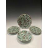 Four Chinese Canton celadon plates, circa 1900, each decorated with birds and butterflies amongst