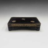 A Chinese wood and gilt metal inlaid stand, 19th century, with pierced bracket feet, paper label