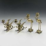 Two pairs of Japanese bronze candlesticks, early 20th century, a pair in the form of cranes on