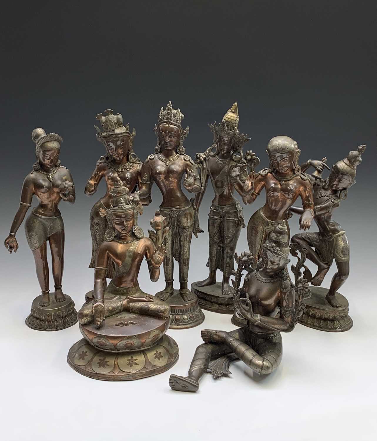 Eight Indian bronze figures of deities, 20th century, height of largest 45cm.