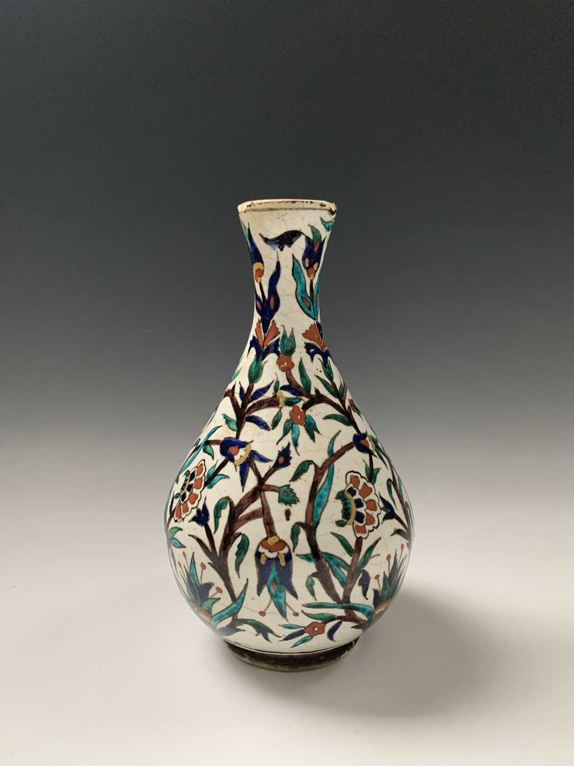 An Iznik pottery vase, 19th century, the bulbous body with a white ground and decorated with - Image 6 of 14