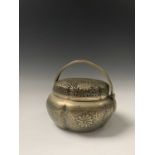 A Chinese bronze hand warmer, Qing Dynasty, signed Pan Xiangli, the twin handles above a pierced