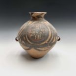 A Chinese Neolithic painted pottery storage jar, Banshan type, painted with swirls and panels in