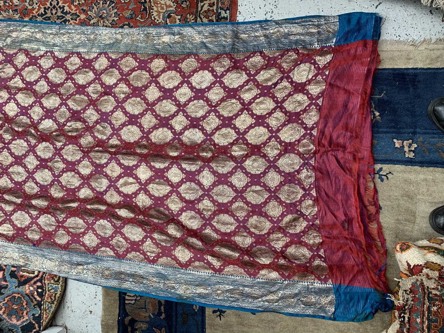 A North Indian sari, the red ground with rows of gold metal thread medallions, 488 x 109cm.Condition - Image 11 of 17